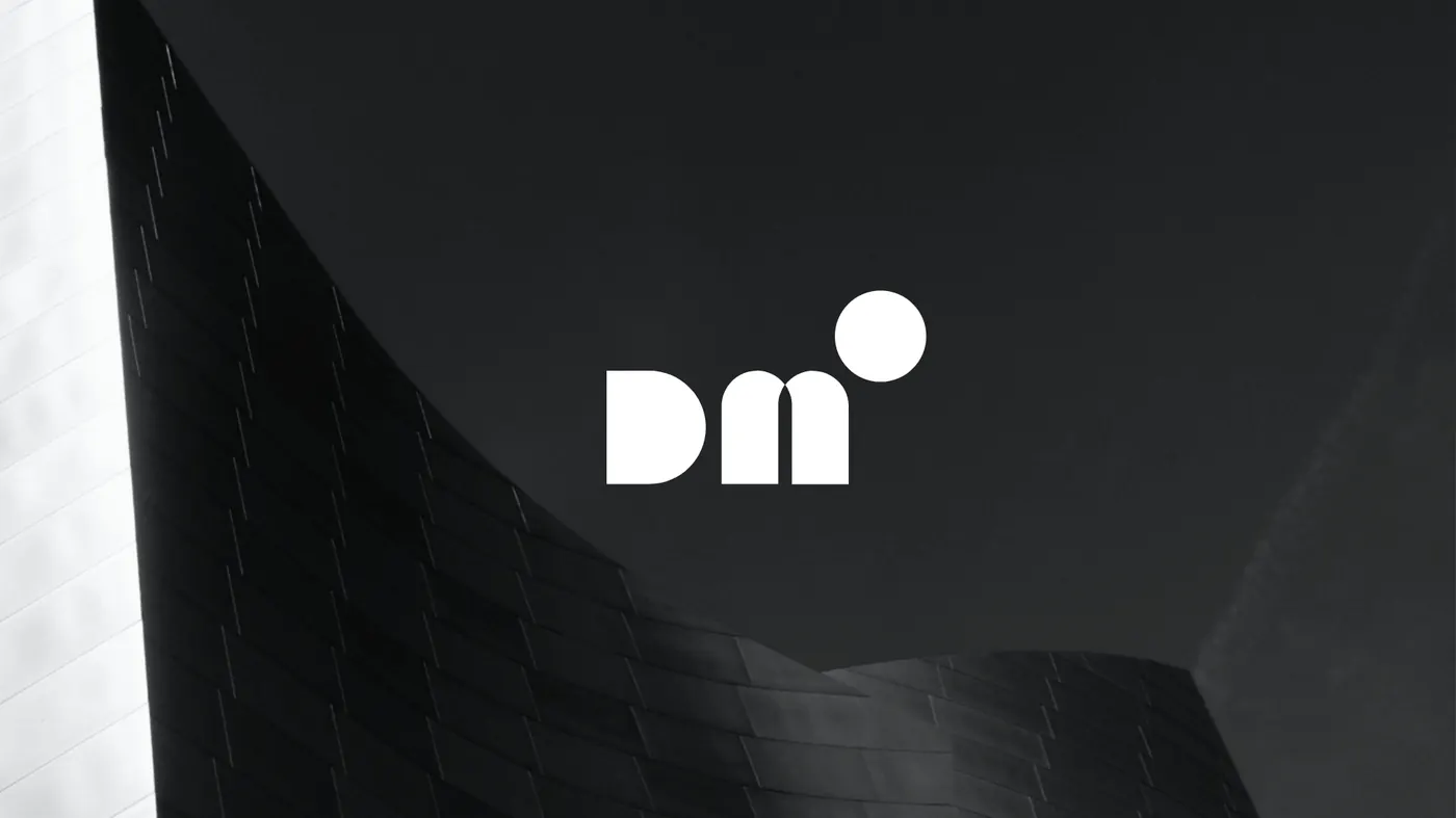 The DOM logo in white over a black-and-white photo of a curved building facade
