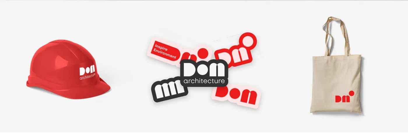 A red hard hat, DOM stickers and a canvas tote bag with the logo